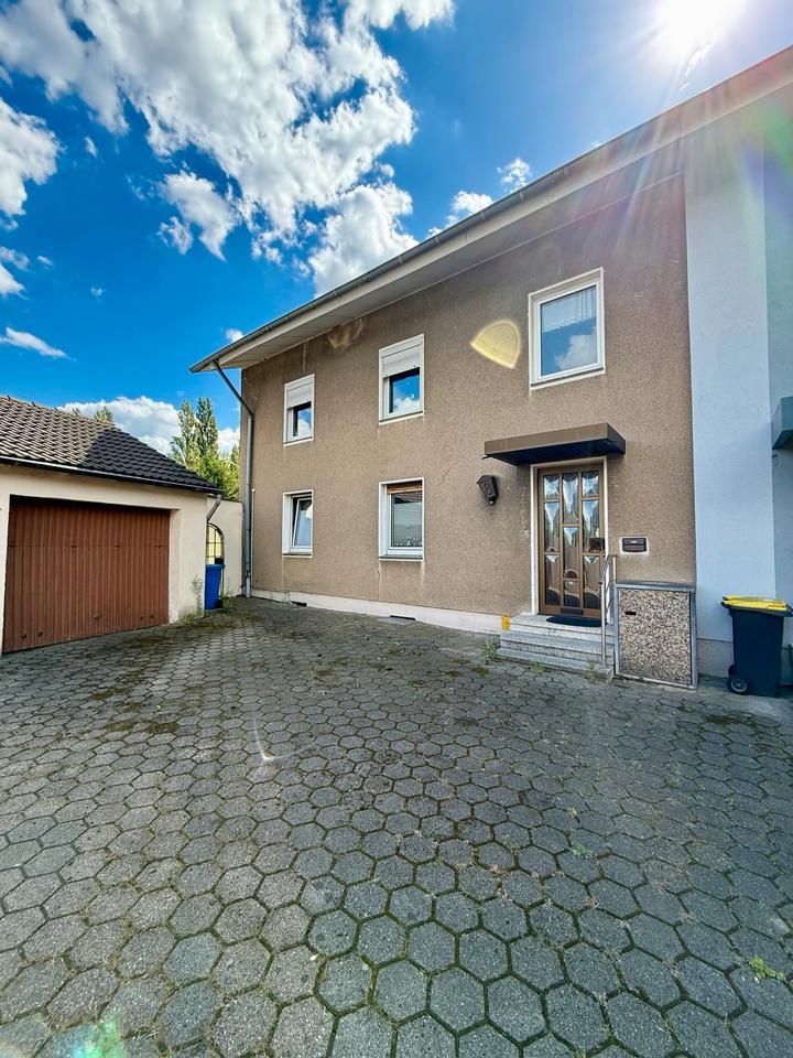 Familienfreundliches Wohnen: Haus mit Garten, Terrasse und Balkon